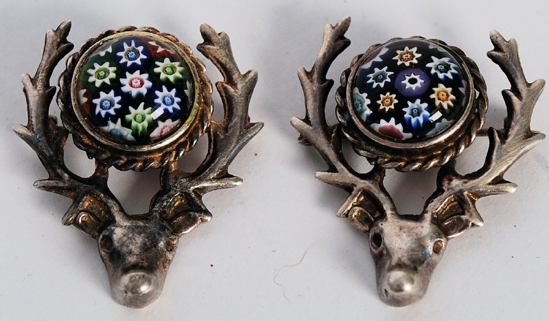 A pair of silver hallmarked stags head brooches having milliefiori centres. The brooches