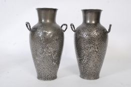 2 Art Nouveau pewter dwarf vases having foliate design to the handbeaten bodies