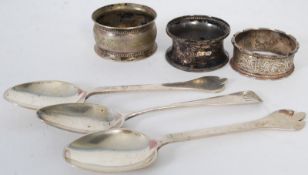 A quantity of hallmarked silver to include 3 spoon and 3 napkin rings. All hallmarked to each