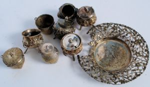 A selection of Indian white metal silver to include salts, basket and other items. Each having