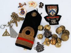 A collection of military coat and hat badges together with airplane brooch, epaullettes for