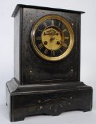 A 19th century slate mantel clock with brass movement and dial, with 8 day movement striking on a