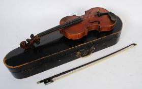 A vintage 20th centruy 3/4 size violin, in original case along with an ebonised and mother of