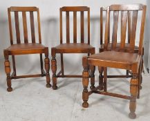 A set of 4 1930's Art Deco rail back dining chairs having bow top rails, drop in seats with cup