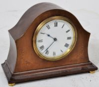 An Edwardian inlaid mahogany mantel clock having Buren Swiss movement being set on brass ball feet