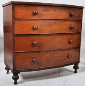 A Georgian bow front mahogany chest of drawers. Raised on bun feet with 4 deep drawers under