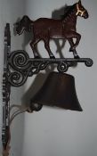 A wall hanging cast metal door bell in the form of a horse. 39 cm long.
