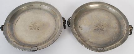 A pair of silver plate Garrard & Co of London pressed taste de vin's of decorative form.