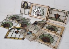 A collection of stained and leaded art deco glass window panels