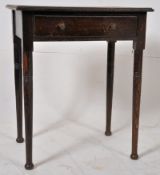 An early 20th century oak writing table in the Jacobean style. Tall turned and tapering legs with