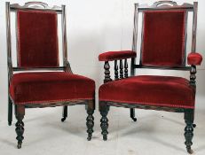 A Ladies and Gentlemans pair of armchairs being late Victorian, raised on turned legs with red