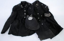 2 Bristol police uniforms having numbers to collars together with a policemans hat.