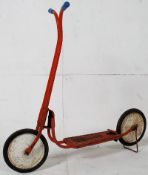A 1950's Triang metal childs ride on toy scooter.