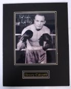 HENRY COOPER: An original signed autograph of boxer Henry Cooper in a 3/4 length pose with gloves to