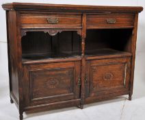 A Victorian oak sideboard buffet having twin door cupboard to base with open shelf to centre and 2