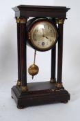 A 19th century HAC Hamburg America Co Portico clock having plinth base with 4 columns, circular face
