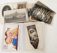 A collection of vintage black and white photographs dating to the early 20th century together with