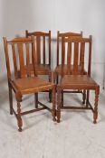 A set of 4 1920's oak barleytwist rail back dining chairs with drop in seats and barley twist legs