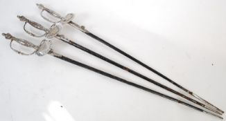 3 Masonic ceremonial swords complete with the leather scabbards with the hilts being inscribed to