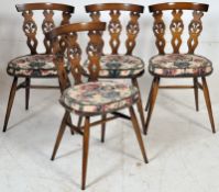 A set of 4 Ercol  dining chairs in the Jacobean revival style having turned legs united by