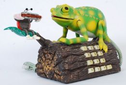 A Karma Chameleon dancing iguana advertising telephone. Battery operated with movement and lights.