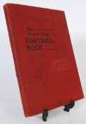 A 1963-64 edition of The Topical Times Football Book, filled with autographs and signatures from