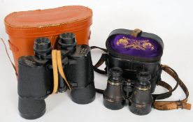 A pair of Negretti & Zambra binoculars complete in the original leather case together with another