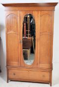 An American mahogany early 20th century , Circa 1910 double wardrobe. The base having deep drawer