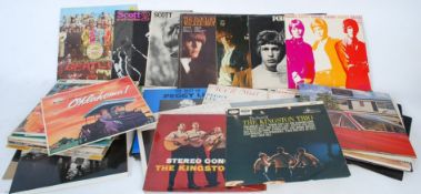 A collection of vinyl LP records to include Beatles Sgt Pepper, Walker Brothers etc.