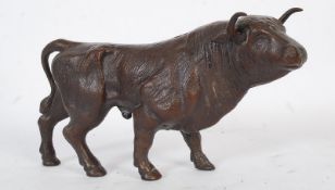 A 20th century cast metal study of a bullock. 28cm in length.