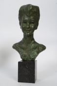 Ernest Patris cold cast metal bust of a young girl, being cold painted.