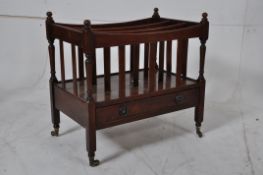 A good quality Regency style canterbury stand / magazine rack. Raised on castors with turned legs