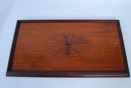 An Edwardian mahogany inlaid serving / butlers tray having gallery side with sunburst effect inlay