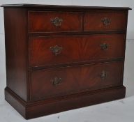 A Georgian style mahogany coaching chest of drawers. The plinth base having two short drawers over 2