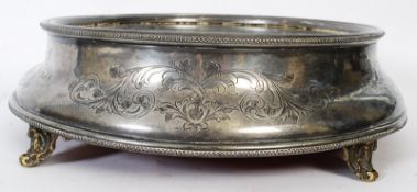 A late 19th / early 20th century silver plate wedding cake stand with mirrored base standing on feet