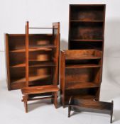 An assorted collection of bookcase cabinets to include tall open window, slatted sides etc along