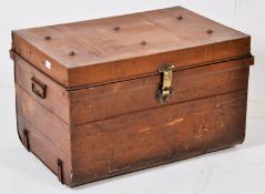 A good 20th century tin travelling trunk in brown