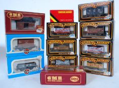 A collection of 12 00 gauge railway train set tenders to include makes by Airfix, Palitoy and