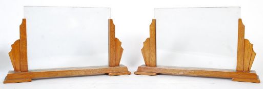 A pair of 1930's Art Deco oak picture frames. The oak plinth bases having cloud shaped sides with