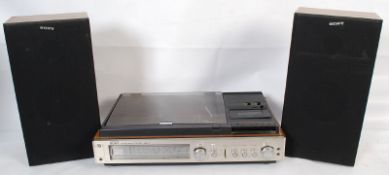 A retro Sony hi-fi stereo centre having record, radio and tape deck complete with two Sony