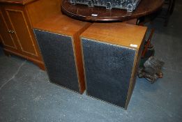 A large pair of retro 1970's teak speakers for Hi-fi by Goodmans. both having labels to the fabric