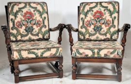 A pair of  Ercol armchairs  in the Jacobean revival style having turned legs united by stretchers