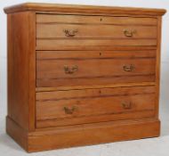 An Edwardian solid walnut cottage chest of drawers. Plinth base with reeded front drawers and flared