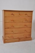 A contemporary pine 2 over 4 chest of drawers. Plinth base with 2 short drawers and 4 deep