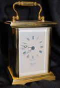 An English Rapport of London brass carriage clock timepiece set within brass case having bevelled