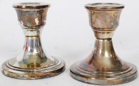 A pair of silver hallmarked Birmingham candlesticks. Illegible makers mark, the candlesticks