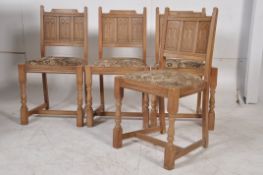 A set of 4 limed oak linen fold carved dining chairs dating to the 1940's. Raised on turned legs