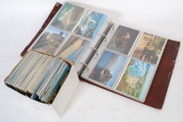 A very large photo album of postcards circa mid 20th century onwards together with another box