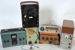 A collection of vintage radio and television testing / repair equipment and accessories to include a