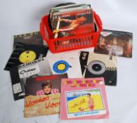 A collection of 45 rpm vinyl records dating from the 1960's through to the 1990's